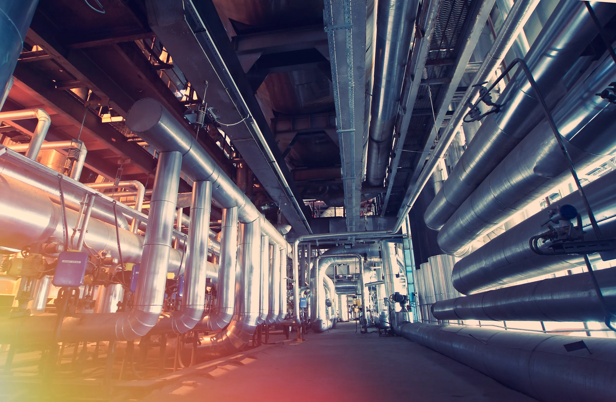 Industrial Facility Interior with Large Piping System