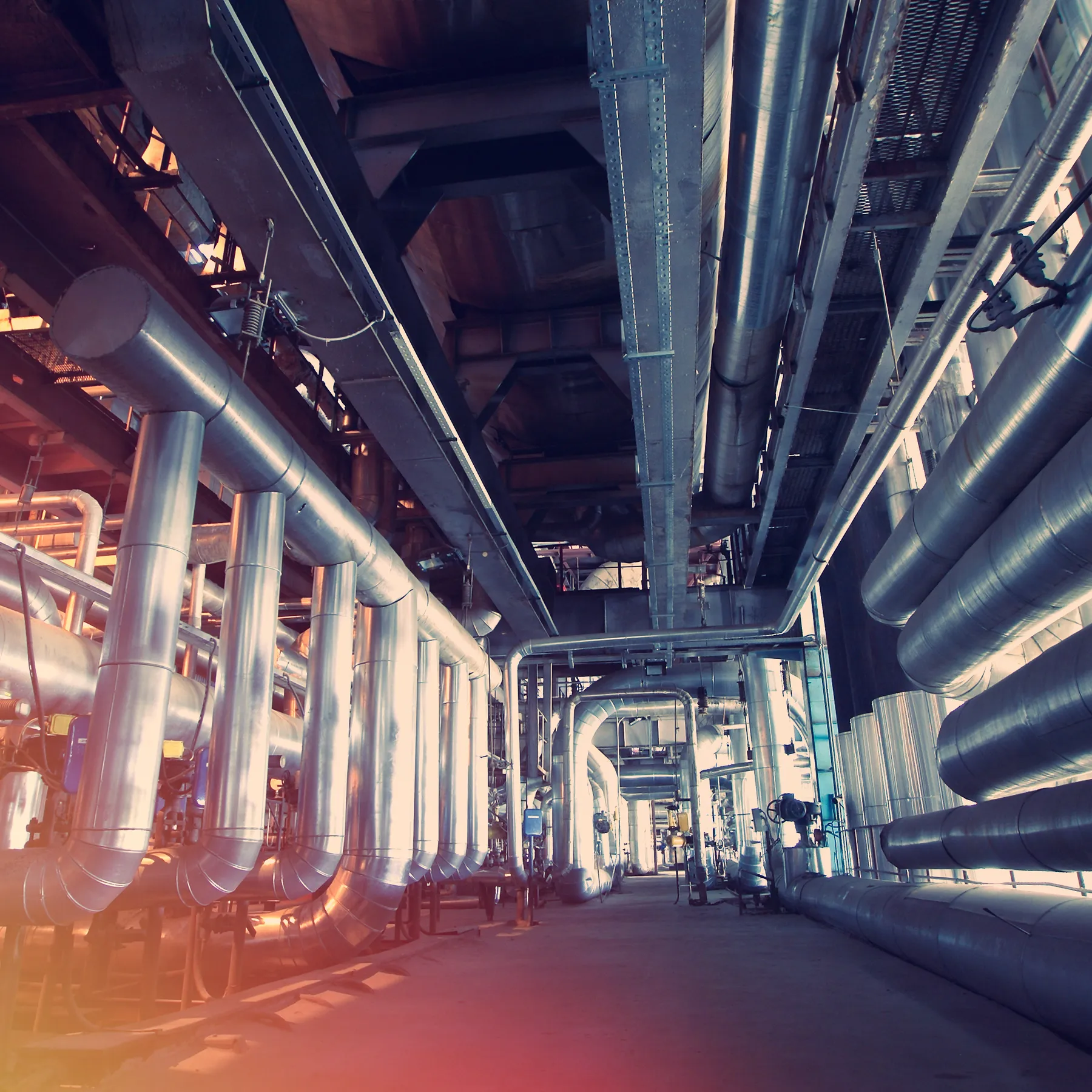 Industrial Facility Interior with Large Piping System